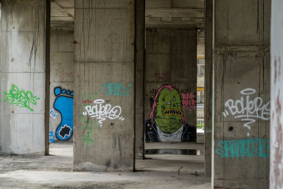 Graffiti artists and urban explorers have left their mark on the unfinished building.