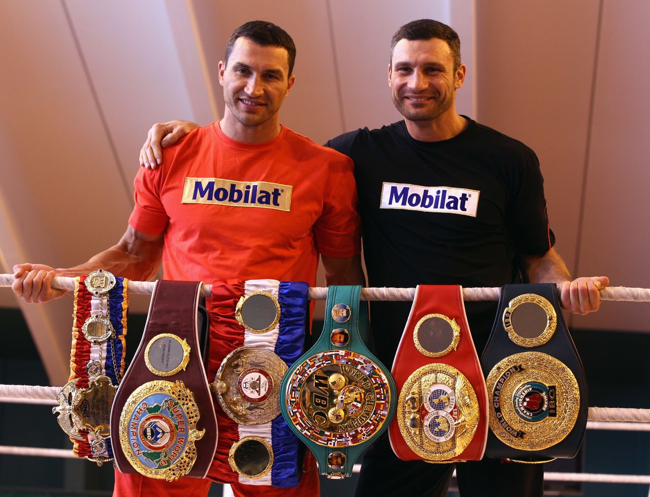 Klitschko (left) and brother Vitali pose with their championship belts in 2012. 