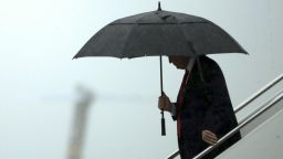 U.S. President Donald Trump holds an umbrella after stepping out of Air Force One in Joint Base Andrews, Maryland, U.S., on Friday, July 28, 2017. Trump replaced his chief of staff Reince Priebus today announcing on Twitter that he had appointed Homeland Security Secretary John Kelly to the job. Photographer: Chip Somodevilla/Pool via Bloomberg