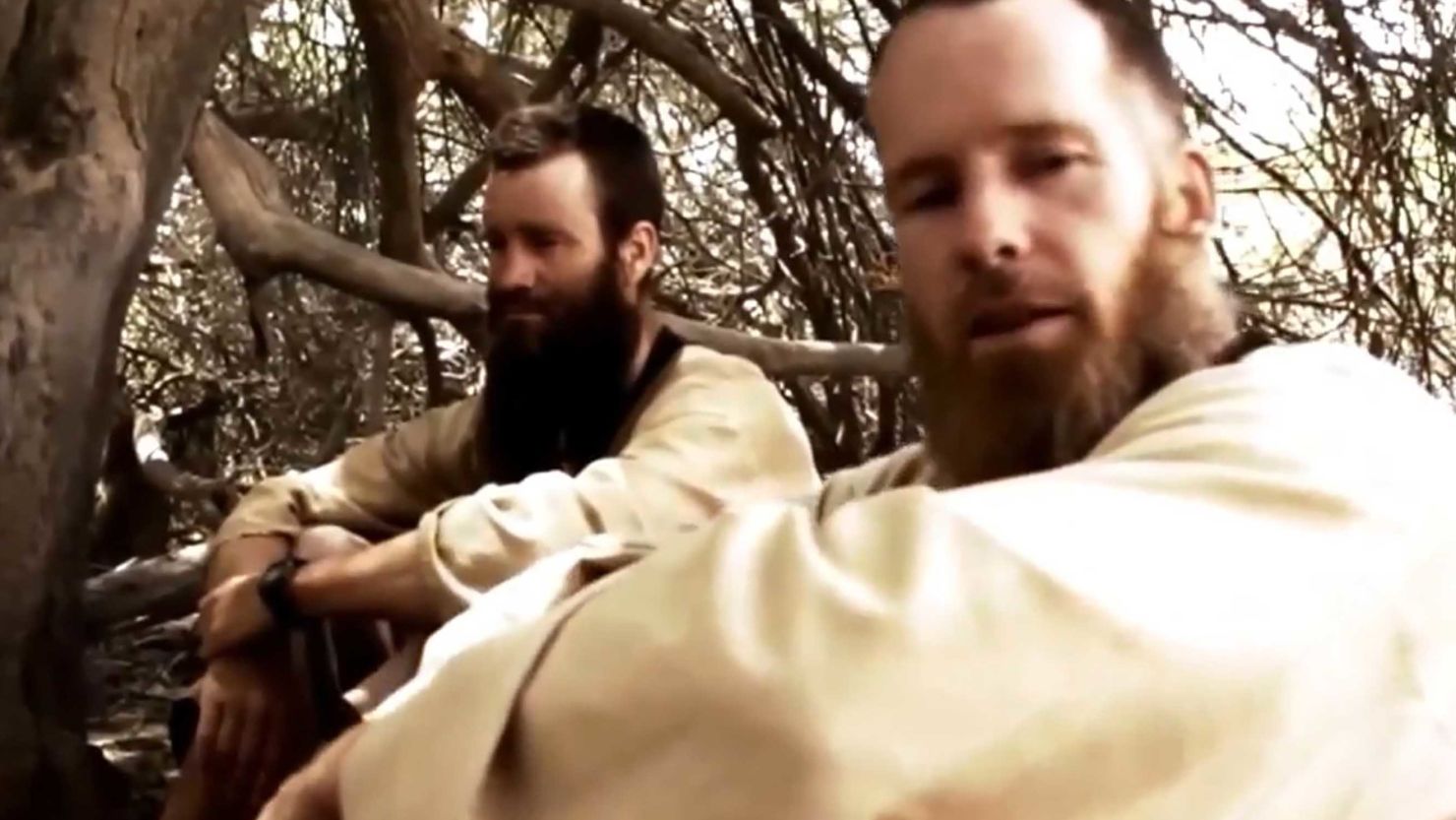 A file image, taken in 2015 from an undated video released by al Qaeda's media branch,  allegedly shows Johan Gustafsson and Stephen McGown (R).