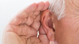 Close-up Of A Senior Man Trying To Hear Hand Over Ear; Shutterstock ID 474426655