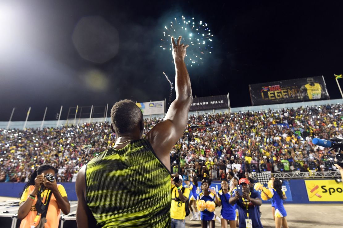 Usain Bolt of Jamaica salutes the crowd after winning 100m "Salute to a Legend " race during the Racers Grand Prix at the national stadium in Kingston