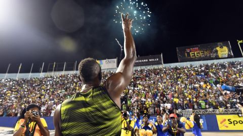 Usain Bolt of Jamaica salutes the crowd after winning 100m "Salute to a Legend " race during the Racers Grand Prix at the national stadium in Kingston