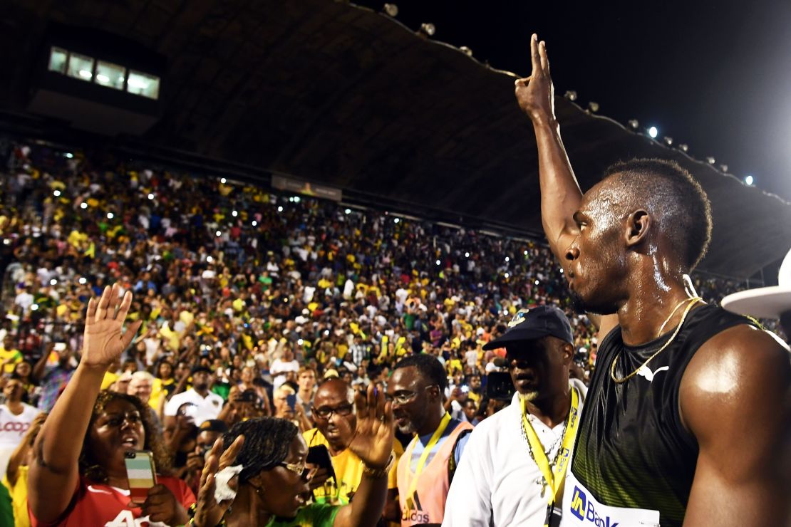 Bolt salutes the crowd after running his final race in Jamaica 
