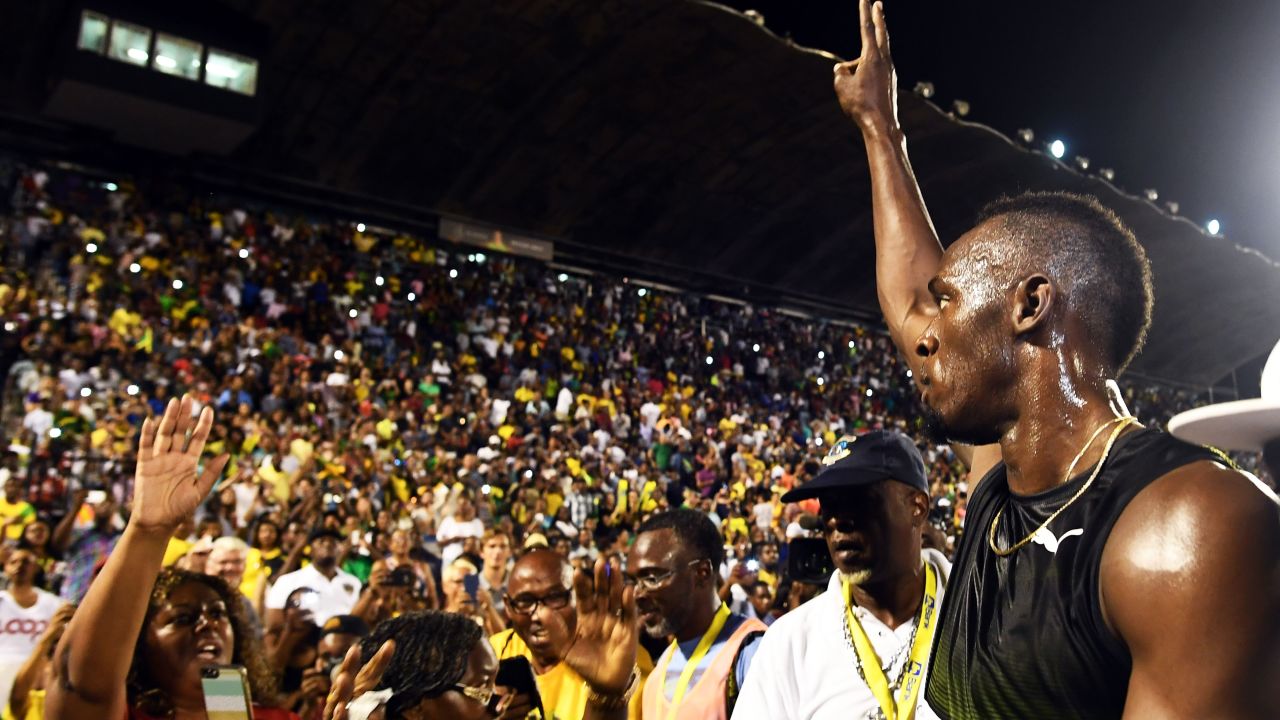 Bolt salutes the crowd after running his final race in Jamaica 