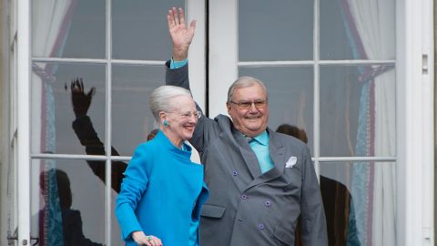 Queen Margrethe and Prince Henrik greet well-wishers from the balcony on the occasion of the Queen's 76th Birthday in April 2016.