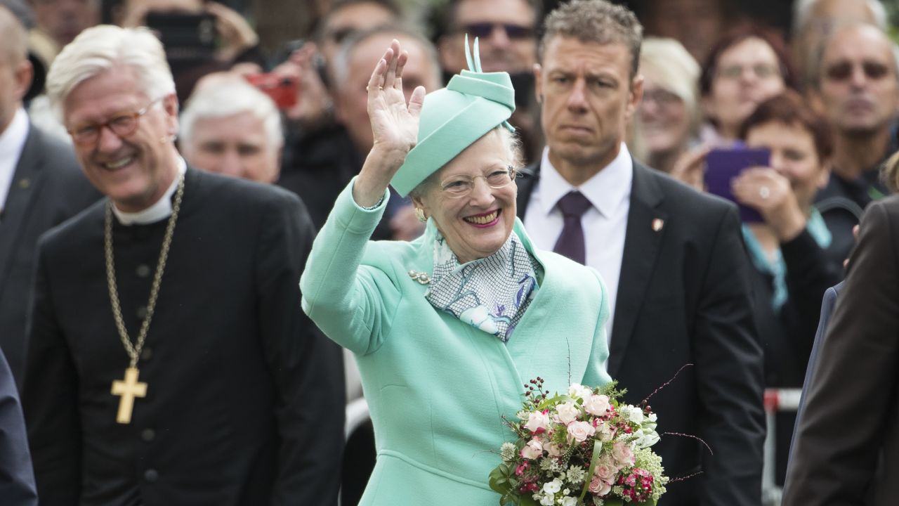 Queen Margrethe II of Denmark waves to well wishers outside the All Saints' church in Wittenberg, eastern Germany, on October 2, 2016.
