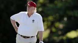 Donald Trump stands on the 14th fairway during a pro-am round of the AT&T National golf tournament at Congressional Country Club in Bethesda, Md. (AP Photo/Patrick Semansky)