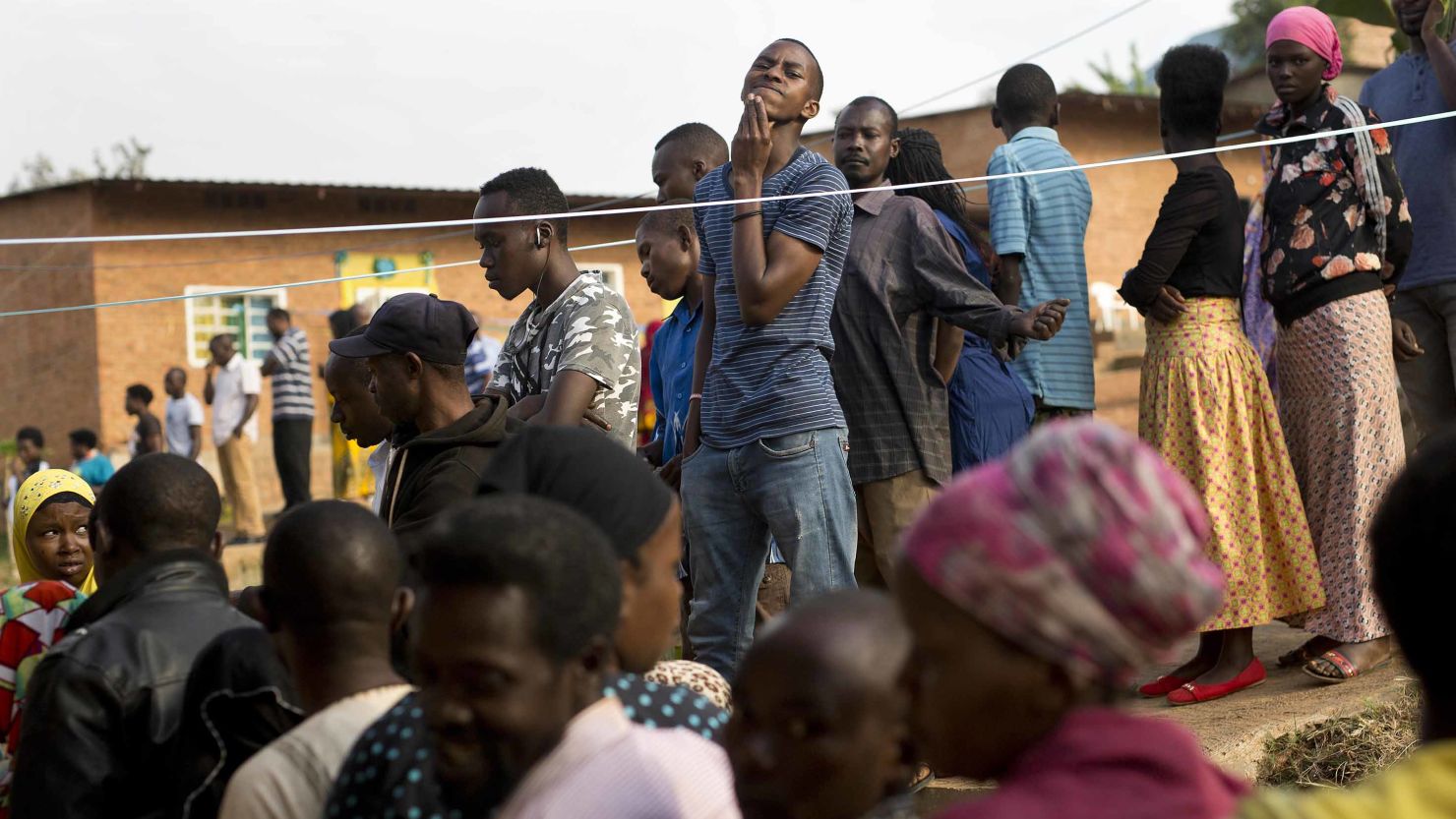Rwandans line up to vote at a polling station in Rwanda's capital, Kigali, on Friday.