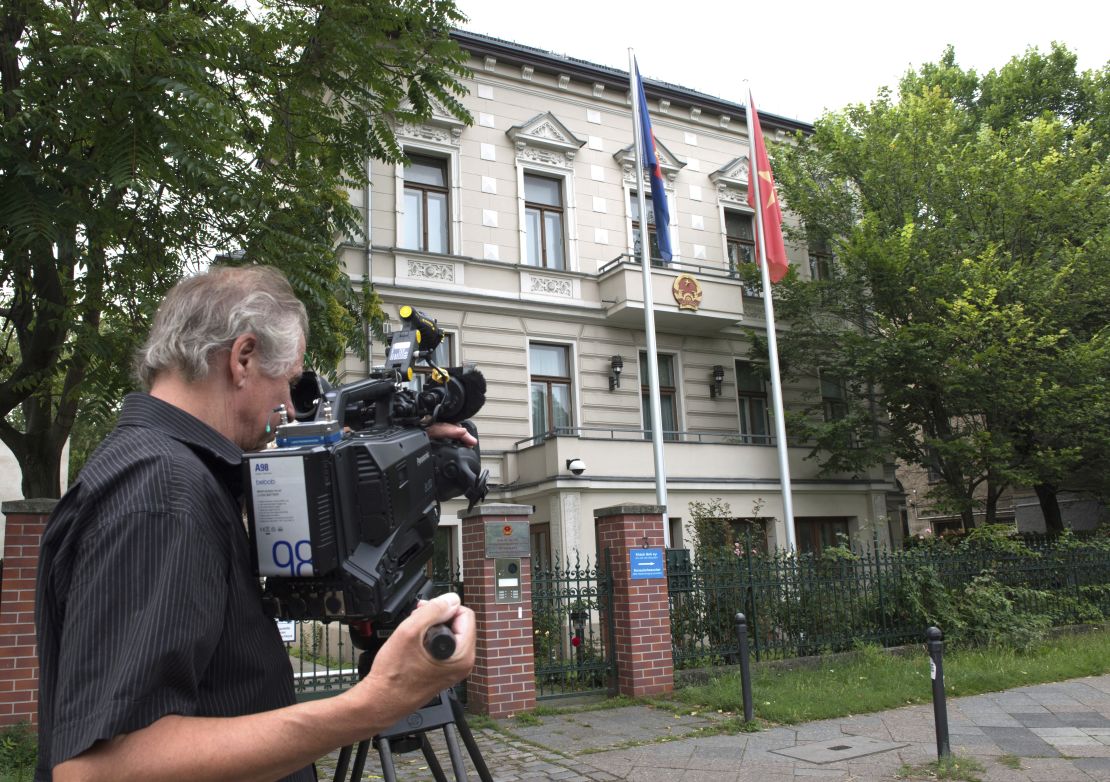 A  cameraman stands in front of the Vietnamese Embassy in Berlin on August 2.