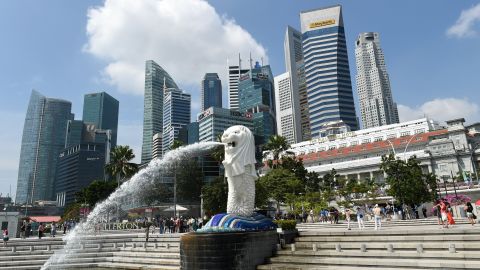 Singapore's famous Merlion (C) in front of the skyline of the city's financial business district.