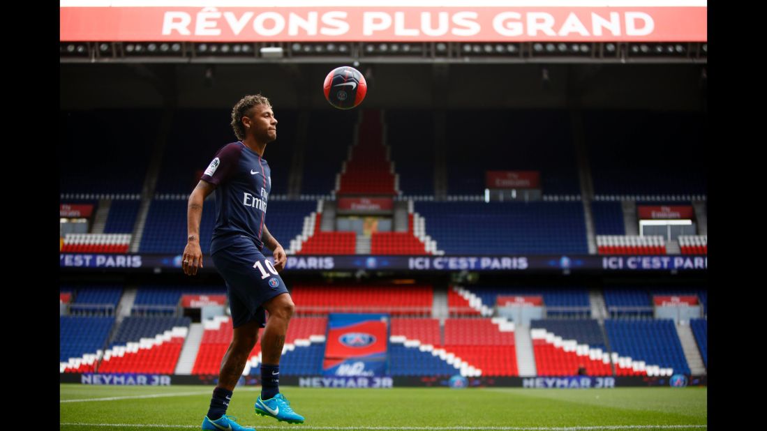 Neymar juggles a ball Friday, August 4, after he was unveiled to the media as Paris Saint-Germain's newest signing. His transfer fee was more than double the previous world record.