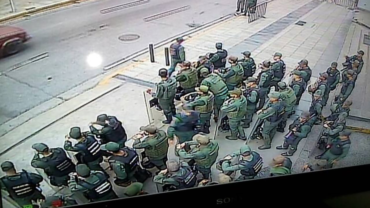 An image distributed by Ortega's press office shows troops outside her office in the capital, Caracas.