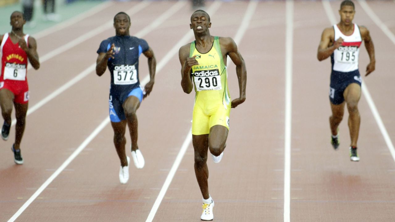 Bolt wins the 200 meters at the 2003 World Youth Championships in Sherbrooke, Canada. He went pro a year later.