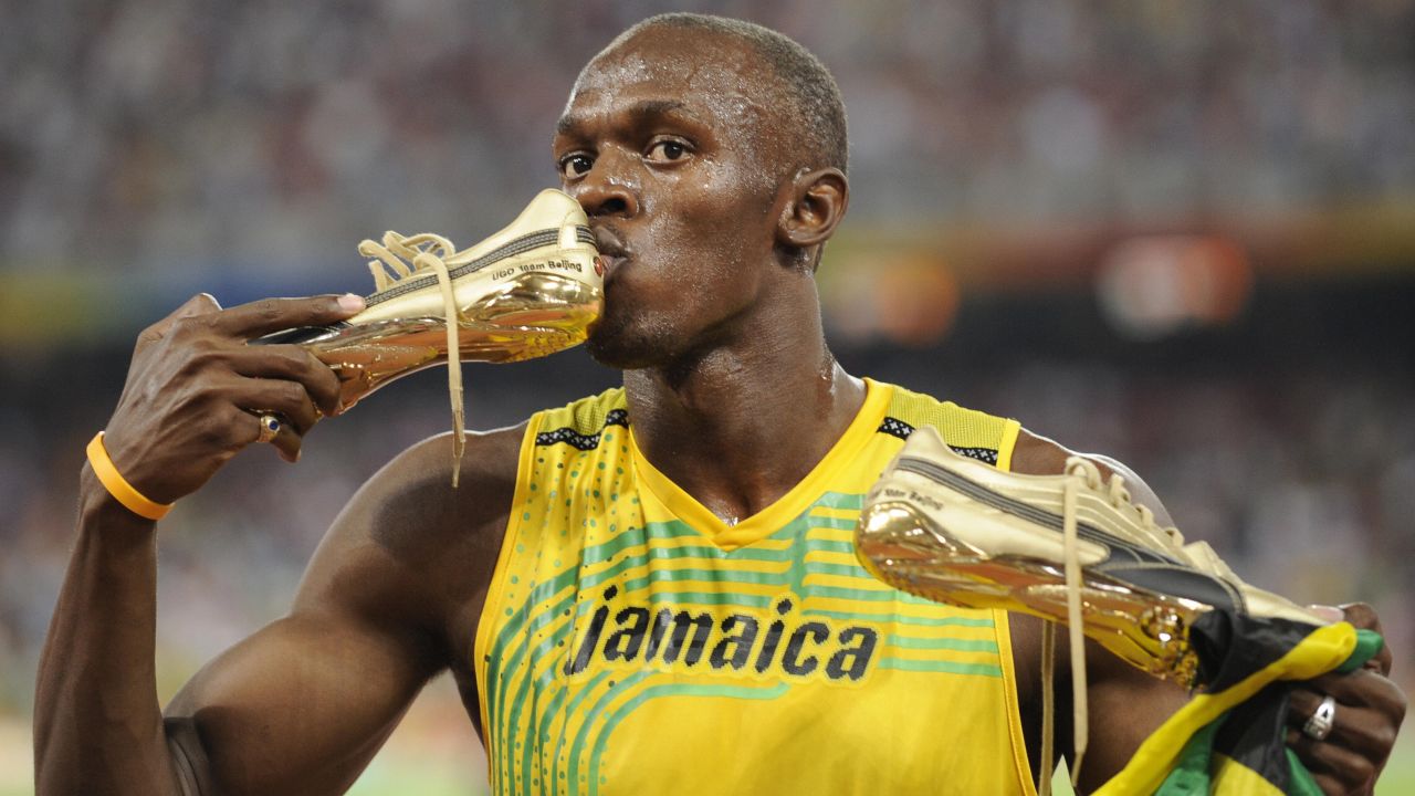 Bolt kisses his shoe after winning the men's 100-meter final at the 2008 Olympic Games. He topped his own world record, finishing in 9.69 seconds.