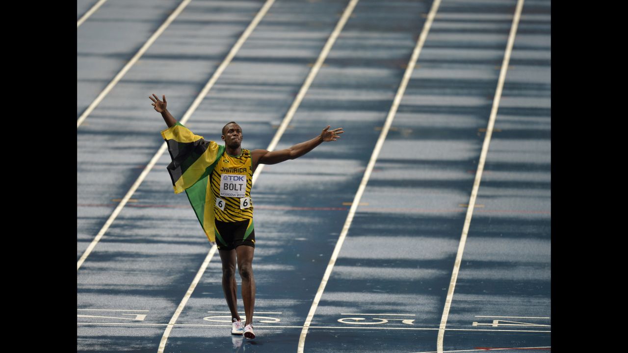 Bolt celebrates after winning 100-meter gold at the 2013 World Championships in Moscow.