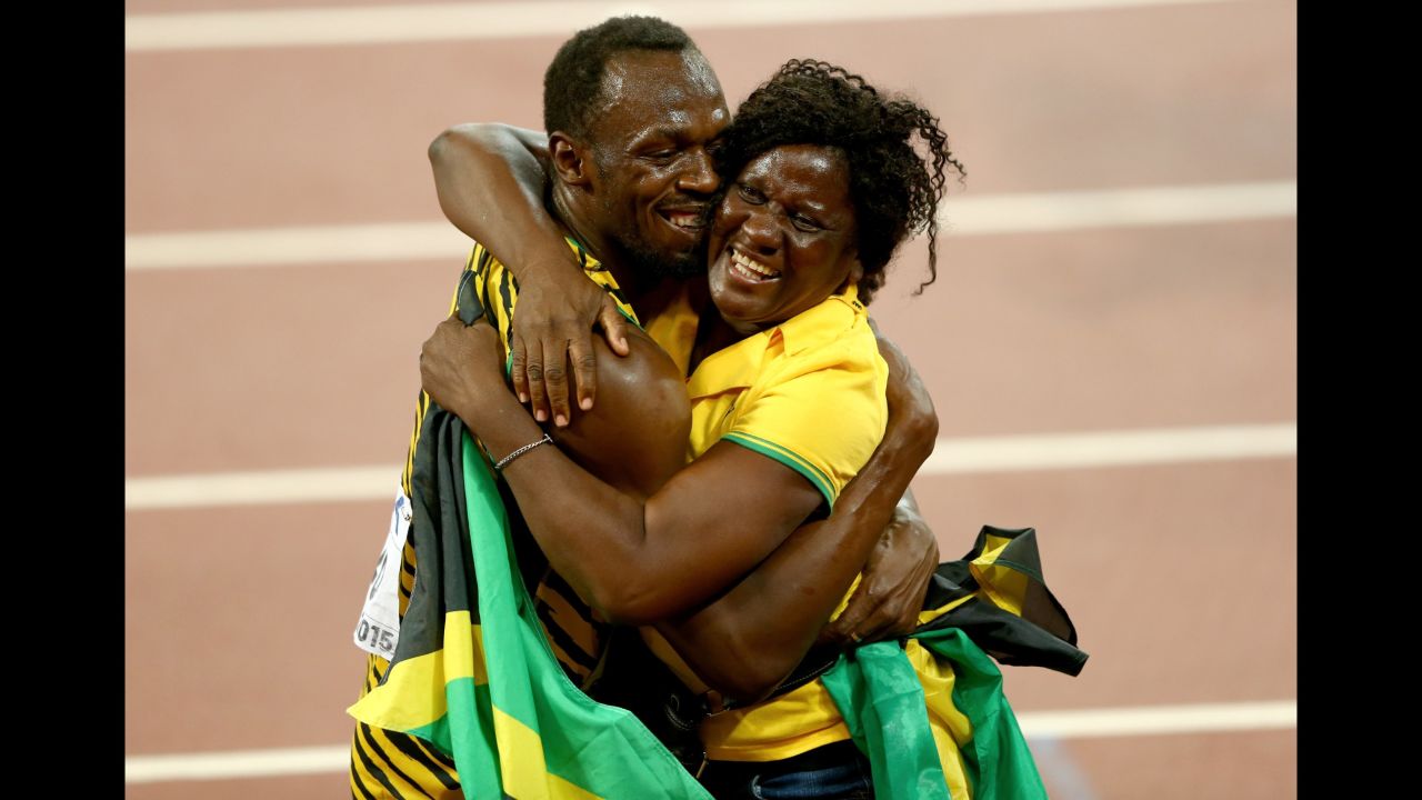 Bolt celebrates with his mother, Jennifer, after winning 100-meter gold at the 2015 World Championships in Beijing.