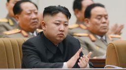  North Korean leader Kim Jong Un (front) claps during a national memorial service in Pyongyang on Dec. 16, 2012, to mark the first anniversary on Dec. 17 of the death of Kim Jong Il, his father and predecessor.