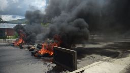 A barricade set by anti-government activists burns in flames in Venezuela's third city, Valencia, on August 6, 2017