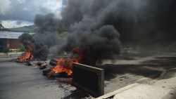 A barricade set by anti-government activists burns in flamesin Venezuela's third city, Valencia, on August 6, 2016, a day after a new assembly with supreme powers and loyal to President Nicolas Maduro started functioning in the country.
In the video posted online earlier, allegedly at an army base used by the National Bolivarian Armed Forces in Valencia, a man presenting himself as an army captain declared a "legitimate rebellion... to reject the murderous tyranny of Nicolas Maduro" and demanded a transitional government and "free elections." After the video surfaced, military chiefs said troops had put down the "terrorist" attack.