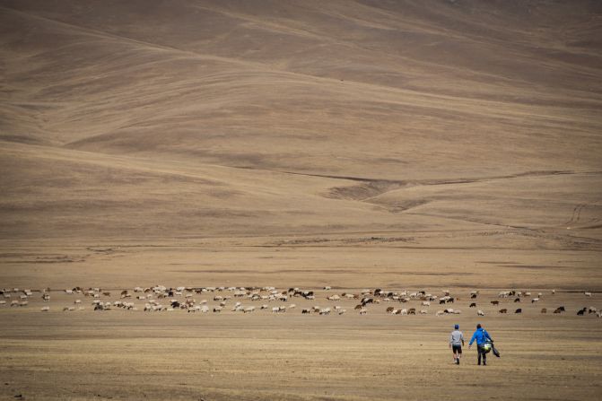 They started on the country's highest mountain -- Khüiten Peak -- and descended onto flatter plans. 