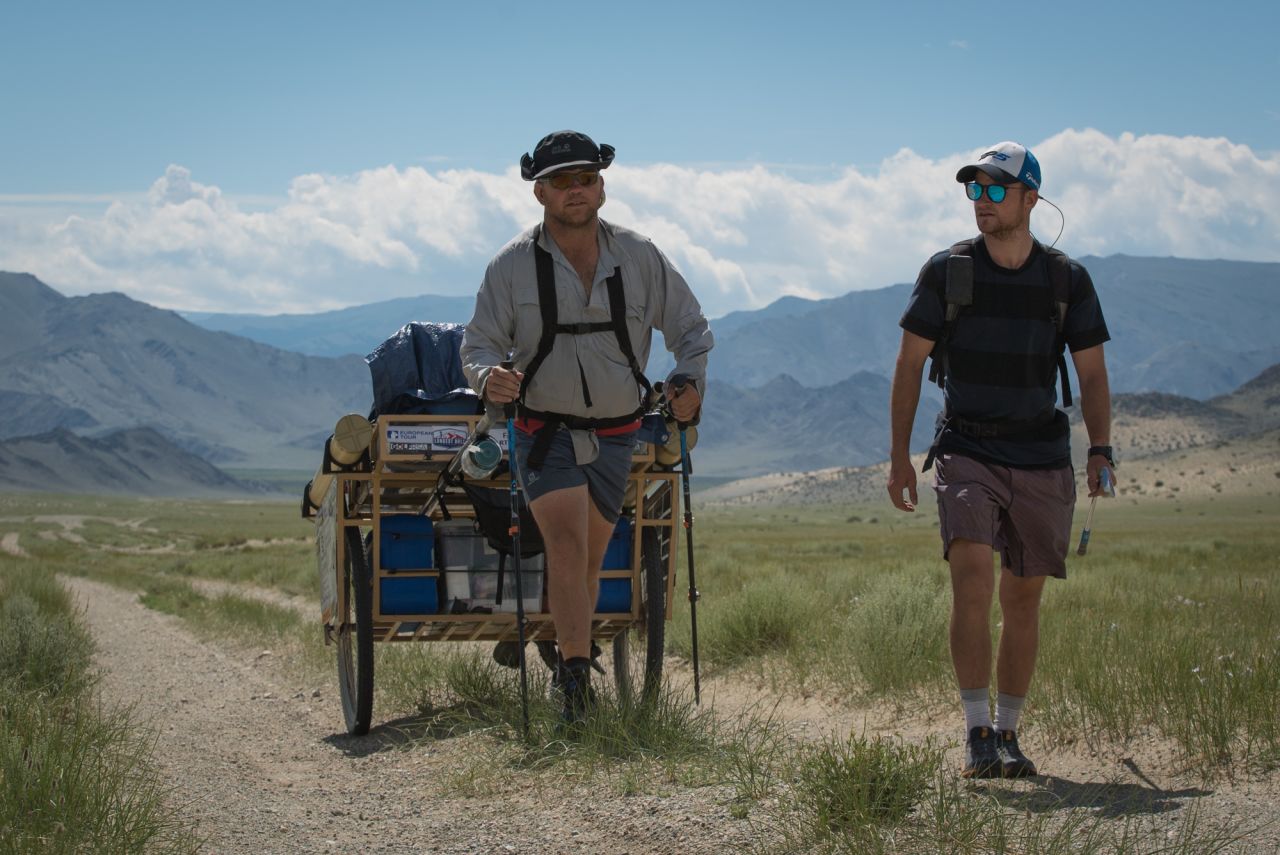 Amateur golfer Adam Rolston (right) and Ron Rutland, serving as his caddy, played the world's longest hole of golf across Mongolia. Rutland pulled a specially-designed cart with their supplies, while Rolston hit the shots.<br />