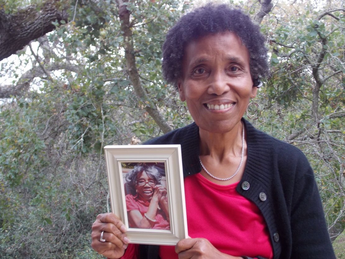 Andrea Gourdine holds a photo of her mother, Gladys Brown, who donated her brain to the University of California-Davis for research.