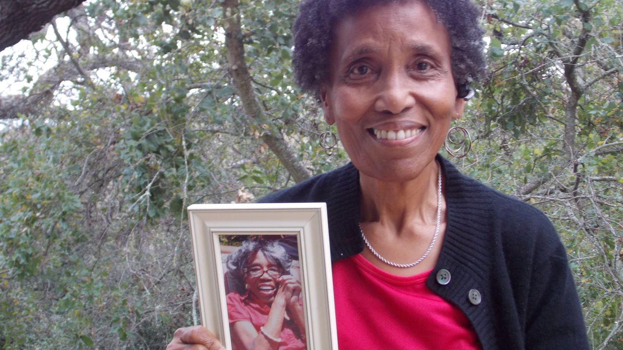Andrea Gourdine holds a photo of her mother, Gladys Brown, who donated her brain to the University of California-Davis for research.