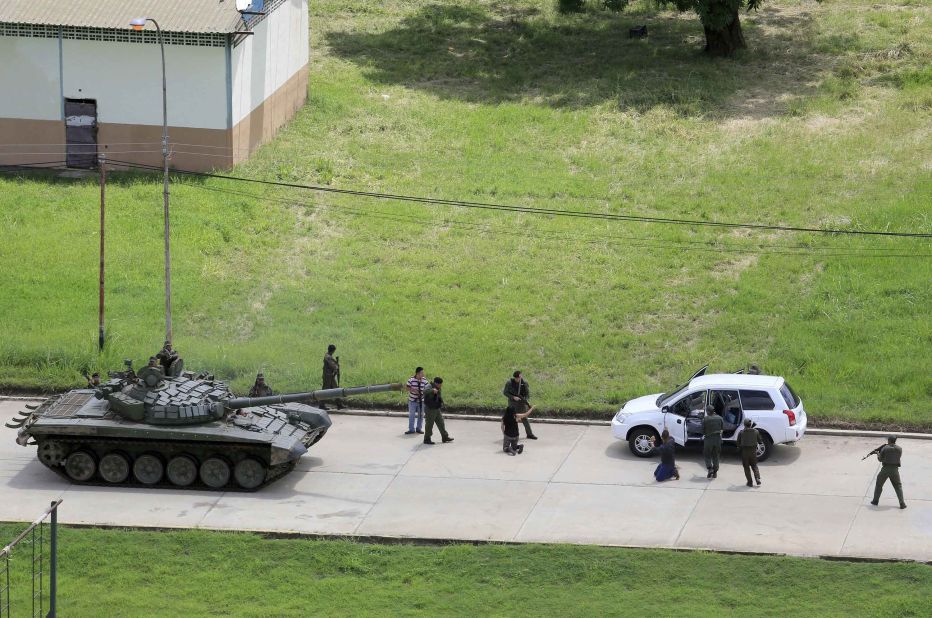 Soldiers stop a vehicle and detain its passengers on the Paramacay military base in Valencia, Venezuela, on August 6. According to authorities, two people were killed when <a href="http://us.cnn.com/2017/08/06/americas/venezuela-unrest/index.html" target="_blank">an anti-government paramilitary attack was quelled</a> at the base.