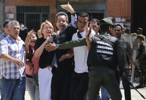 Venezuela's Chief Prosecutor Luisa Ortega Diaz, third from left, is surrounded by employees of the General Prosecutor's office as she is <a href="http://edition.cnn.com/2017/08/05/americas/venezuela-attorney-general/index.html" target="_blank">barred by security forces from entering her office</a> in Caracas on Saturday, August 5.