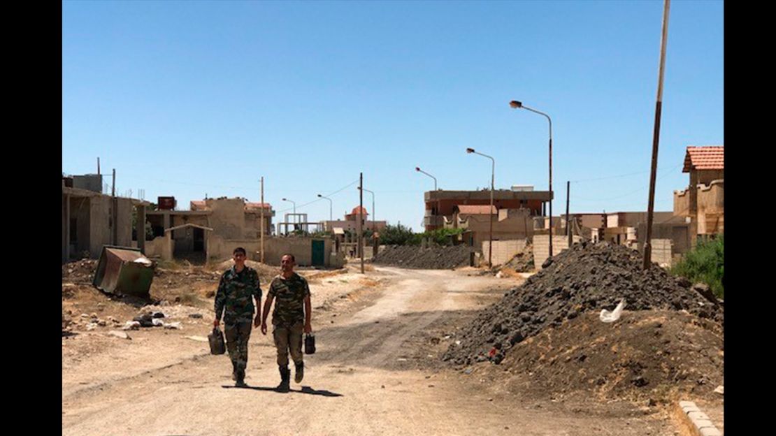 The front line still divides Quneitra, but there is virtually no fighting at the moment, the regime says. Soldiers are relaxed as they go to their battle positions.