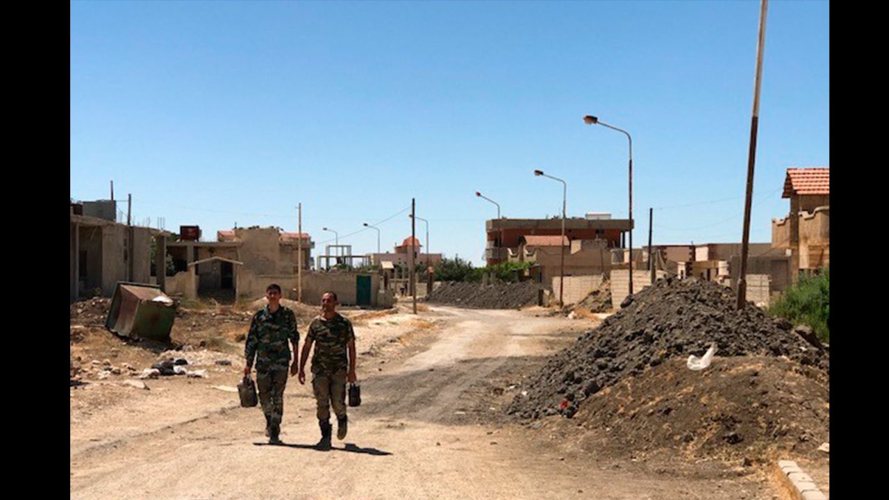 The front line still divides Quneitra, but there is virtually no fighting at the moment, the regime says. Soldiers are relaxed as they go to their battle positions. 