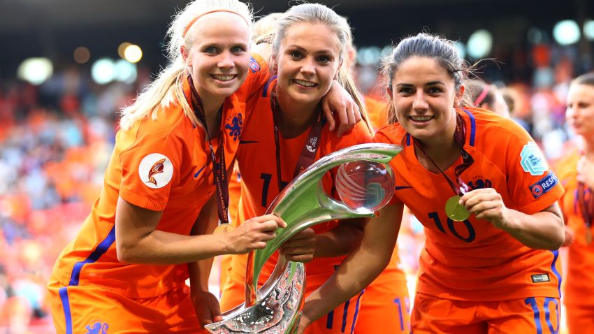 ENSCHEDE, NETHERLANDS - AUGUST 06: Lieke Martens of the Netherlands (C) and Danielle van de Donk of the Netherlands (R) celebrate with the trophy following the Final of the UEFA Women's Euro 2017 between Netherlands v Denmark at FC Twente Stadium on August 6, 2017 in Enschede, Netherlands.  (Photo by Dean Mouhtaropoulos/Getty Images)