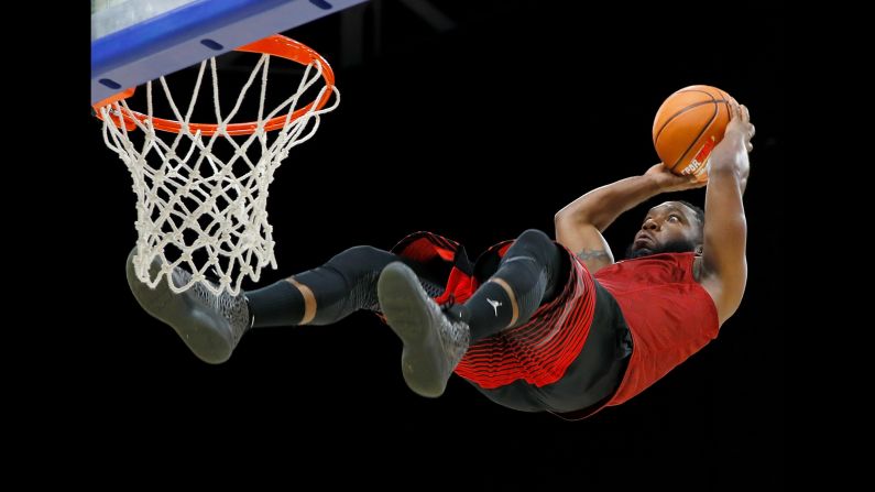 A member of the Air Elite Dunkers, an acrobatic dunk team, performs at a Big 3 basketball event in Lexington, Kentucky, on Sunday, August 6. The team uses trampolines during its act.
