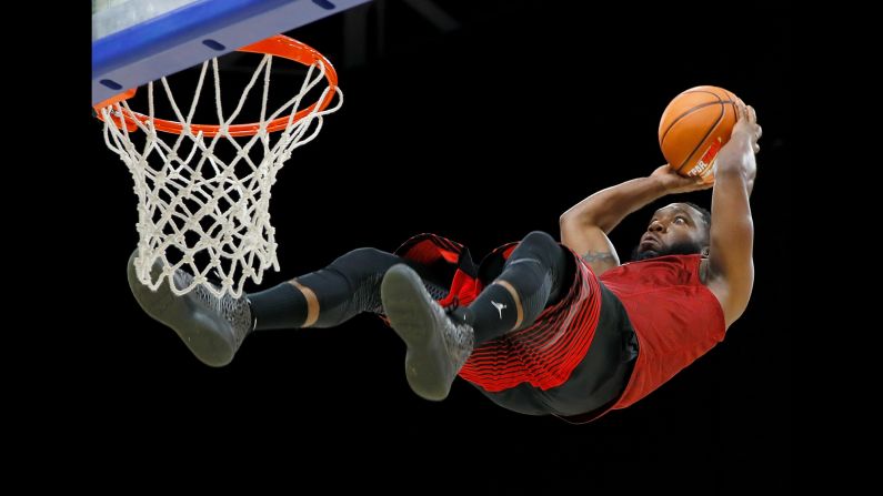 A member of the Air Elite Dunkers, an acrobatic dunk team, performs at a Big 3 basketball event in Lexington, Kentucky, on Sunday, August 6. The team uses trampolines during its act.