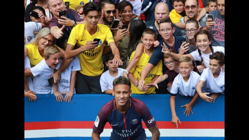 Brazilian soccer star Neymar poses with fans of Paris Saint-Germain on Saturday, August 5, a day after <a href="index.php?page=&url=http%3A%2F%2Fwww.cnn.com%2F2017%2F08%2F03%2Ffootball%2Fneymar-barcelona-psg-transfer%2Findex.html" target="_blank">he officially joined the French club</a> for what is the largest transfer fee in world history ($263 million). <a href="index.php?page=&url=http%3A%2F%2Fwww.cnn.com%2F2017%2F08%2F02%2Ffootball%2Fgallery%2Fneymar-career%2Findex.html" target="_blank">See more photos from his career</a>