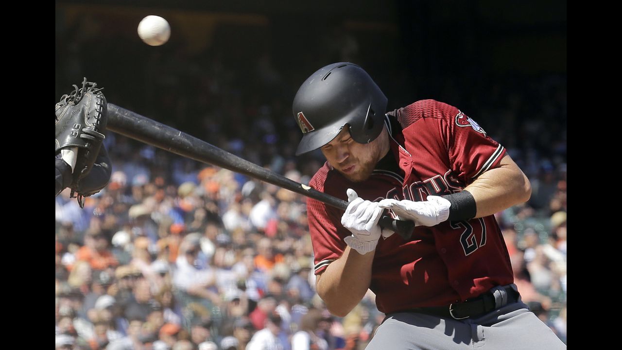 Brandon Drury, pinch-hitting for the Arizona Diamondbacks, takes a pitch off the helmet during a game in San Francisco on Sunday, August 6. He was not hurt.