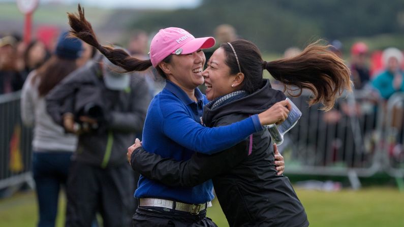 Pro golfer In-Kyung Kim, left, celebrates with her manager after winning the Women's British Open on Sunday, August 6. It was the South Korean's <a href="index.php?page=&url=http%3A%2F%2Fwww.cnn.com%2F2017%2F08%2F07%2Fgolf%2Fbritish-open-south-korea-ik-kim-major-golf-kingsbarn-jodi-ewart-shadoff%2Findex.html" target="_blank">first major victory,</a> five years after her nightmarish loss at the Kraft Nabisco Championship.