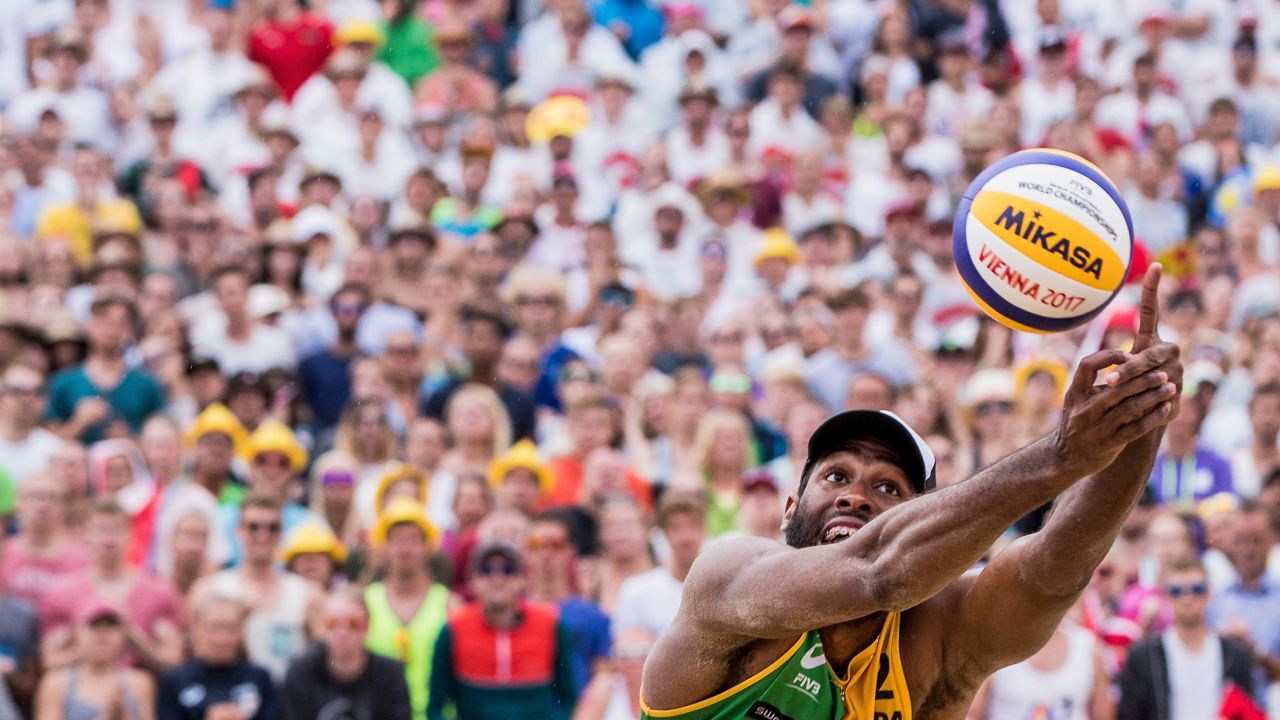 Evandro Goncalves reaches for the ball Sunday, August 6, during the gold-medal match at the Beach Volleyball World Championships. He and Andre Loyola defeated Austrians Clemens Doppler and Alexander Horst.