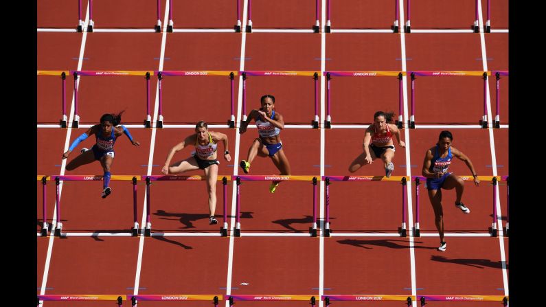 Heptathletes compete in the 100-meter hurdles at the World Championships on Saturday, August 5.