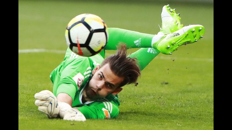 Ilya Pomazun, a goalkeeper for CSKA Moscow, dives for the ball during a Russian Premier League match against Rubin Kazan on Sunday, August 6.