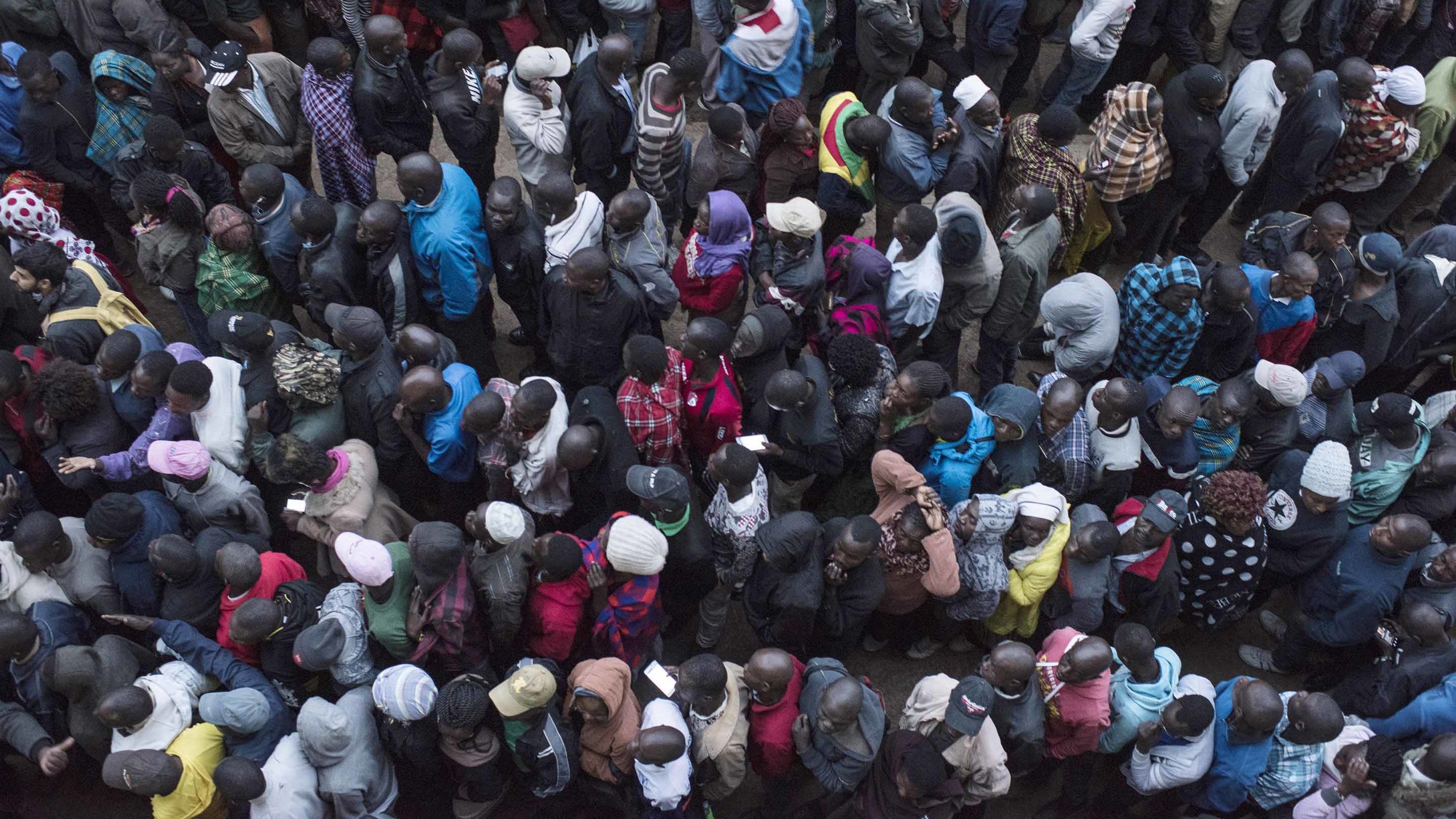 Voters line up at a station in Kibera. 