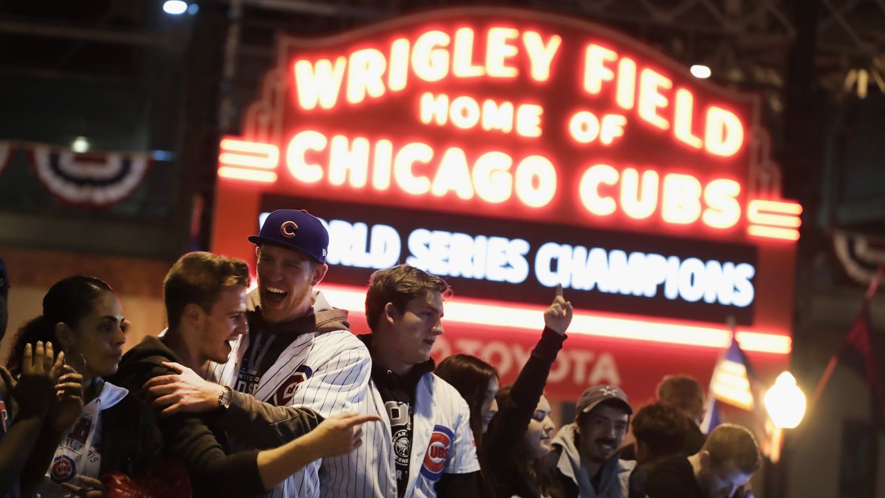 <strong>8. Watch a game in a famous stadium.</strong> You may not witness the World Series but high-fiving frenzied strangers is always fun. <em>Photo by Scott Olson/Getty Images</em>