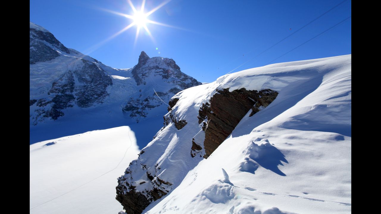 <strong>10. Cross a border on skis, zip line, etc. </strong>Skiing between Switzerland and Italy makes for a truly unforgettable border crossing. <em>Photo by Marka/UIG via Getty Images</em>