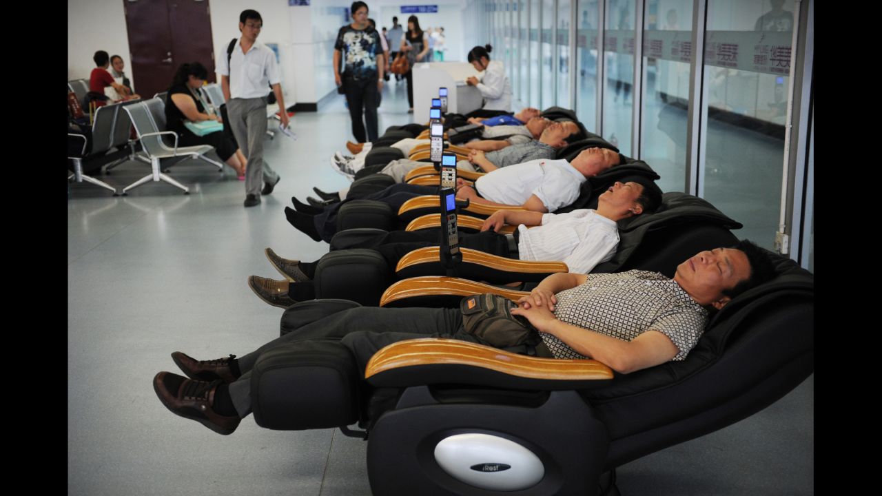 <strong>30. Get a massage in an airport. </strong>If there's one thing on this list you need to do as soon as possible, start here.<strong> </strong> <em>Photo by Peter Parks/AFP/Getty Images</em>