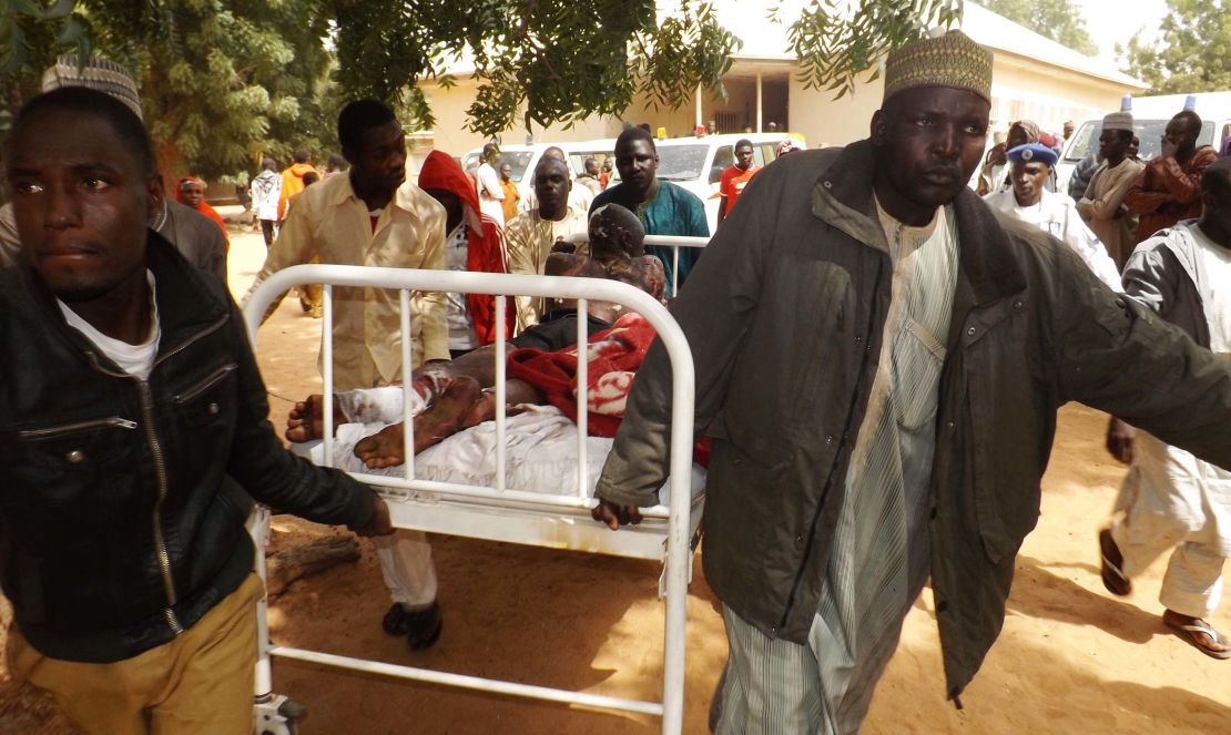 A man injured in a suicide blast in Potiskum, northeastern Nigeria, is transported to a hospital. Four people were killed and 46 injured when two female suicide bombers attacked a mobile phone market on January 11, 2015.