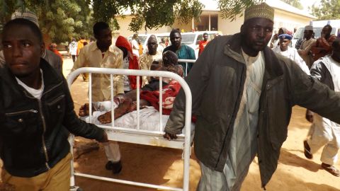 A man injured in a suicide blast in Potiskum, northeastern Nigeria, is transported to a hospital. Four people were killed and 46 injured when two female suicide bombers attacked a mobile phone market on January 11, 2015.