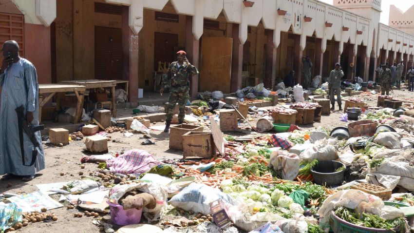 Soldiers stand guard at a market in N'Djamena following a suicide bomb attack on July 11, 2015. At least 14 people were killed in a suicide bomb attack at a crowded market in Chad's capital today just days after Boko Haram claimed a previous bombing in the city that left 38 people dead. The attack in N'Djamena by a man disguised as a woman in a full-face veil came after a botched bombing of a bus station in the restive capital of Nigeria's Borno state, Maiduguri, which killed two pedestrians.  AFP PHOTO / BRAHIM ADJI        (Photo credit should read BRAHIM ADJI/AFP/Getty Images)