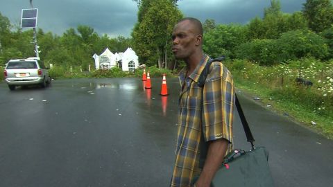Jean-Enice Frederic prepares to illegally cross the U.S.-Canada border.