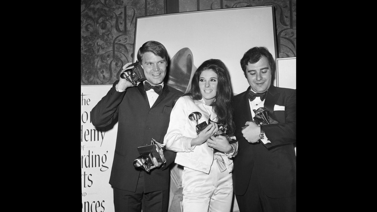 Campbell, Bobbie Gentry and Lalo Schifrin hold the statuettes they won at the 1968 Grammy Awards. Campbell won four Grammys that year.
